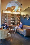 Sun Chandelier Gold 140, large dome hanging light, triangle surface, in wine bar, 