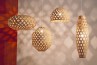 Four stylish hanging lamps, each with a unique hexagonal bamboo design, perfect for modern interior illumination.