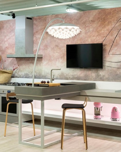 Spacious kitchen with a striking wall mural and a large island, enhanced by Flora pendant lights that create a warm, inviting ambiance.