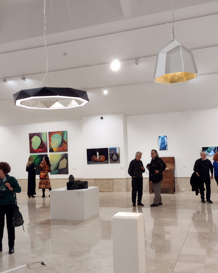 Geometric ten-angled SUN Chandelier illuminating gallery space