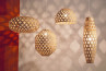 Four stylish hanging lamps, each with a unique hexagonal bamboo design, perfect for modern interior illumination.