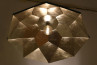 Design exhibition showing geometric and large-scale lighting fixtures